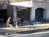 Two Men in front of Shop